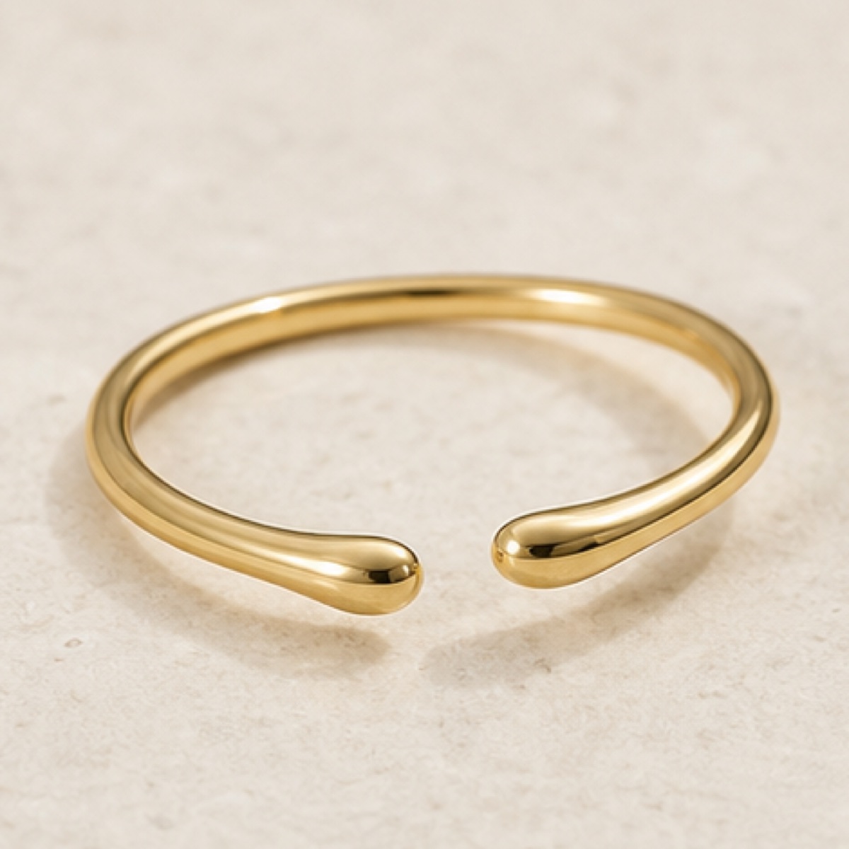 Close detail of polished jewelry links in warm light
